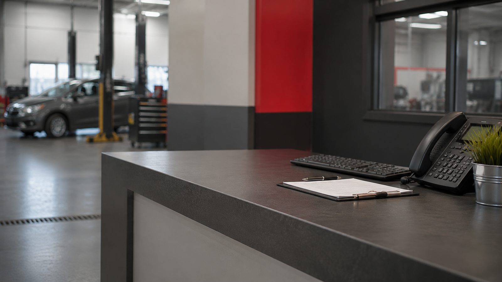 Reception counter at the Beaucage Carrossier shop, with the work area in the background